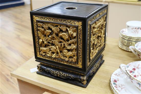 A late 19th/early 20th century Chinese giltwood and black lacquer incense stand